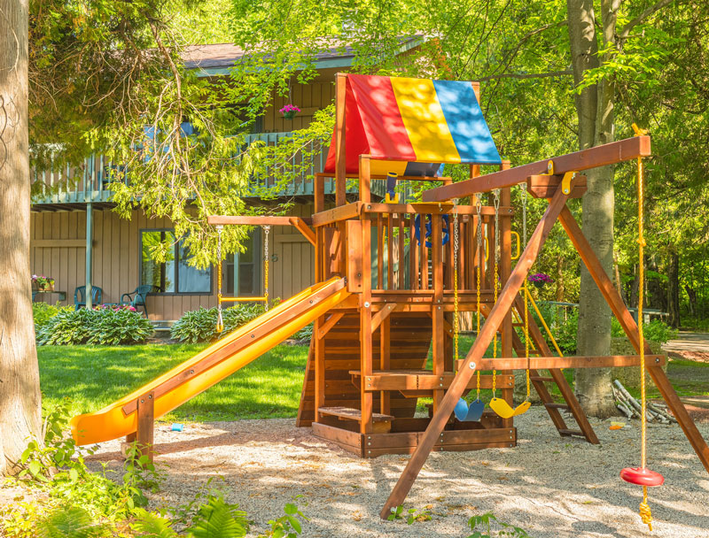 Playground surrounded by trees at the Shallows Resort