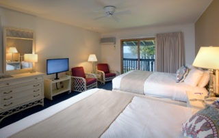  Interior of a Shoreside Motel room with two beds and chairs