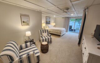 View of the bay through floor to ceiling windows of Shallows Cottage