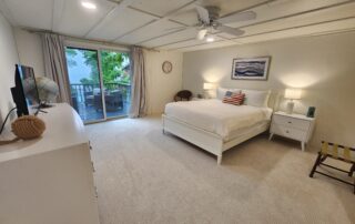View of the bay through floor to ceiling windows of Shallows Cottage